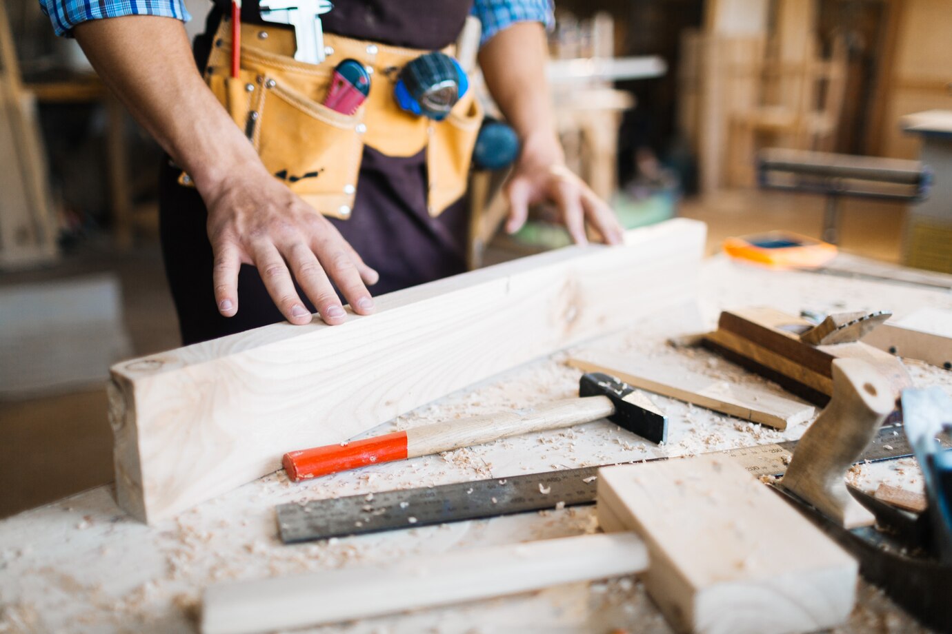 wooden beam, surrounded by tools and wood