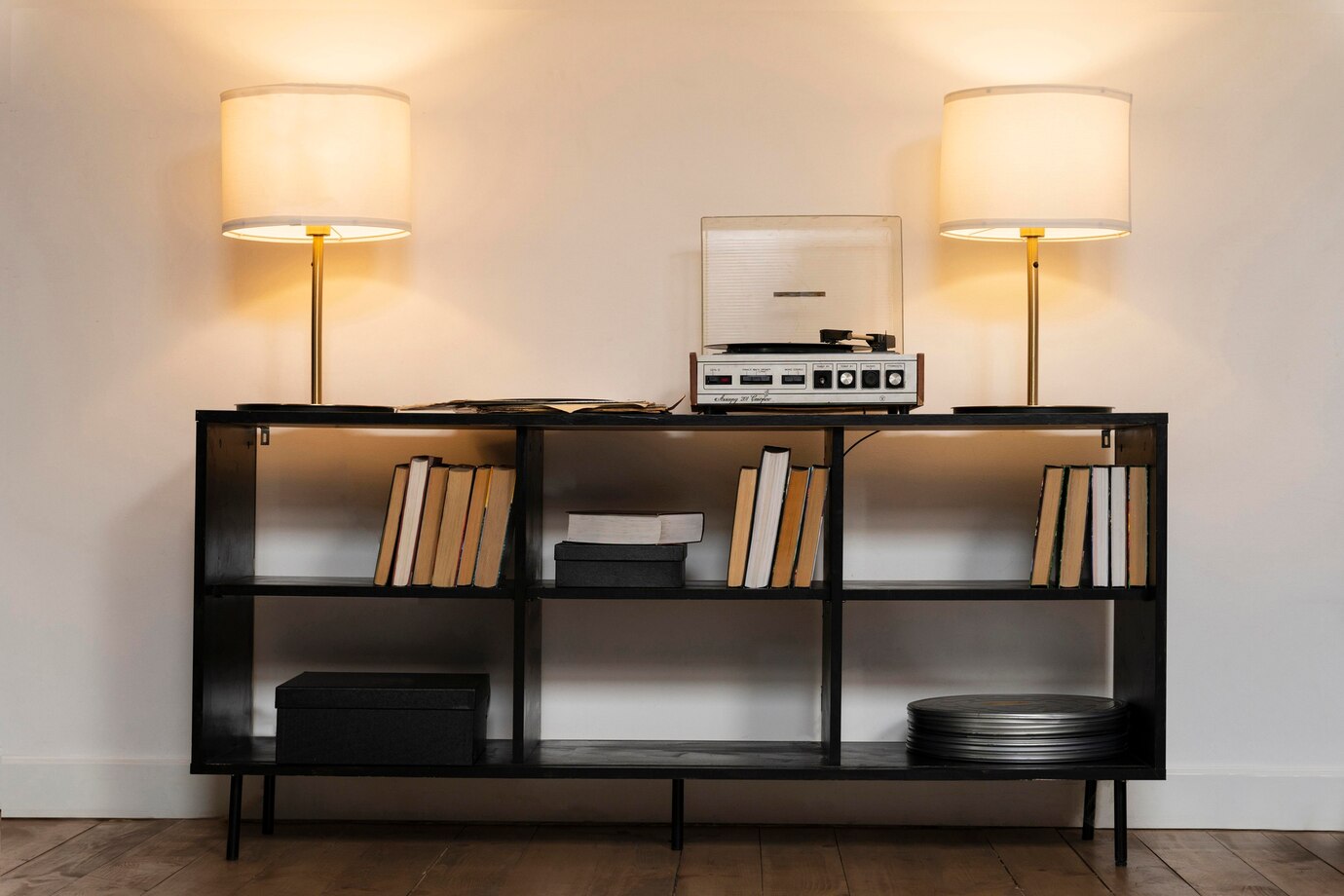 modern black shelf with books, a record player