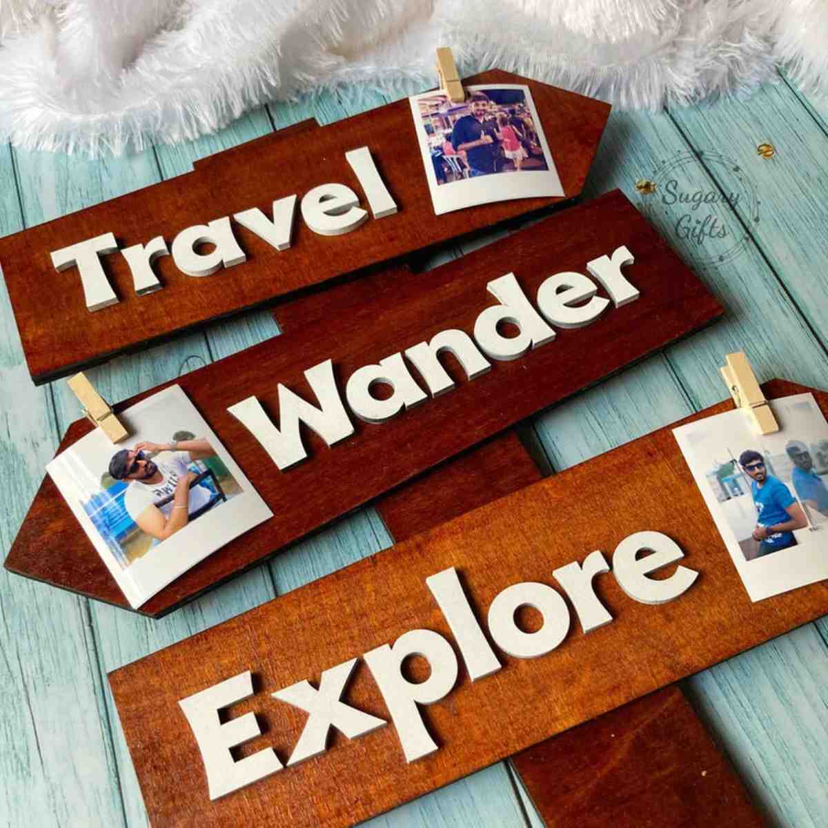 three wooden signs read