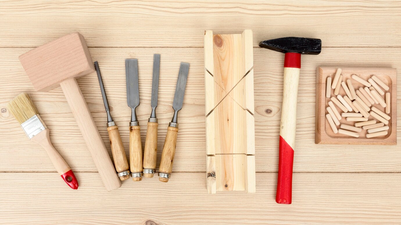 set of woodworking tools including a mallet, chisels, a hammer