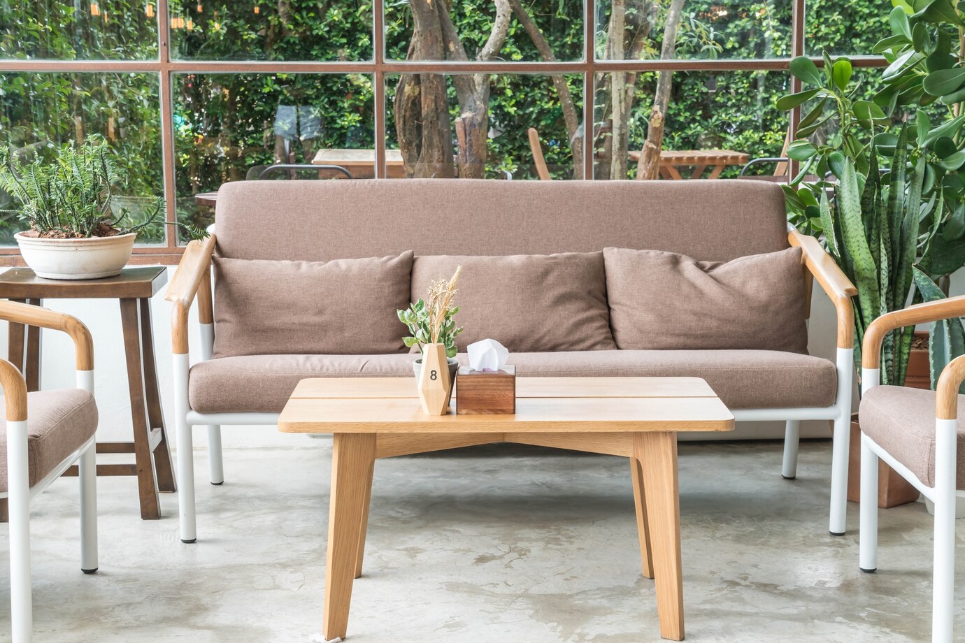 cozy seating area with a brown fabric couch, wooden coffee table