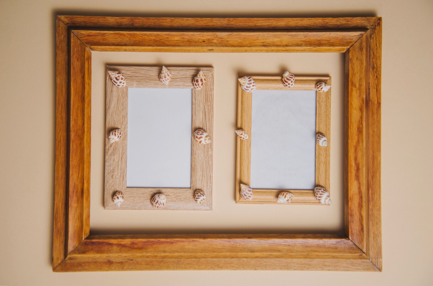 Two wooden picture frames adorned with small seashells