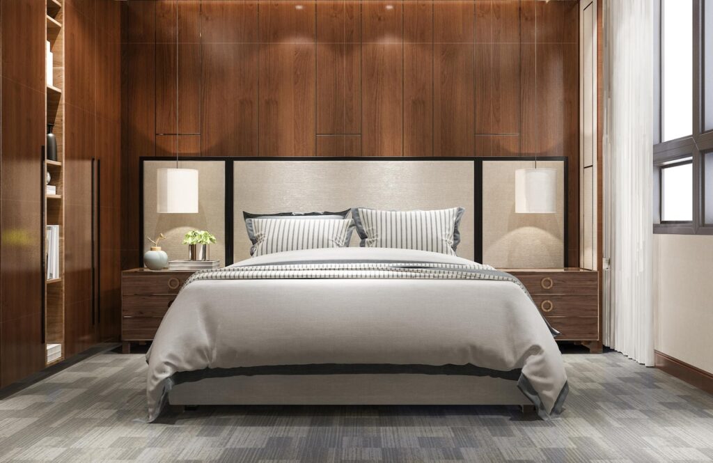 Modern bedroom featuring a gray bed with striped bedding