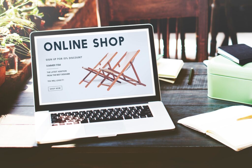 laptop displays an online shop promoting wooden beach