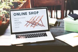 laptop displays an online shop promoting wooden beach