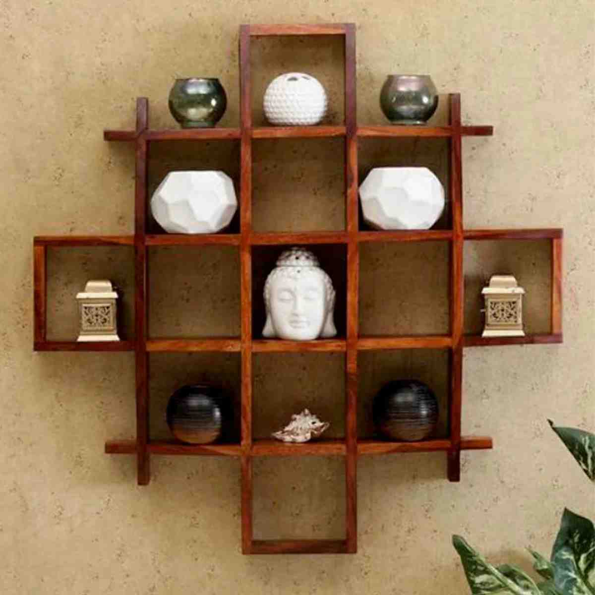 decorative wall shelf featuring a grid design with various ornaments